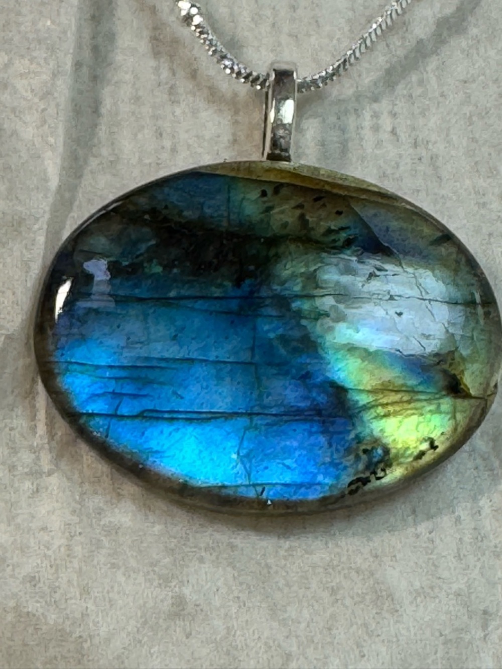 Labradorite Oval Pendant Necklace - Iridescent Blue-Green on SS 18” chain.